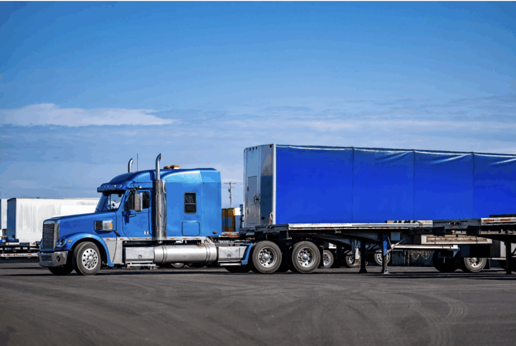 a trailer truck parked in a parking lot